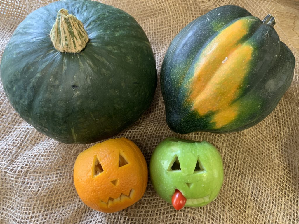 Scary! Orange and apple jack-o-lanterns made these poor kabocha squash so scared that one of them toppled over with fright. 