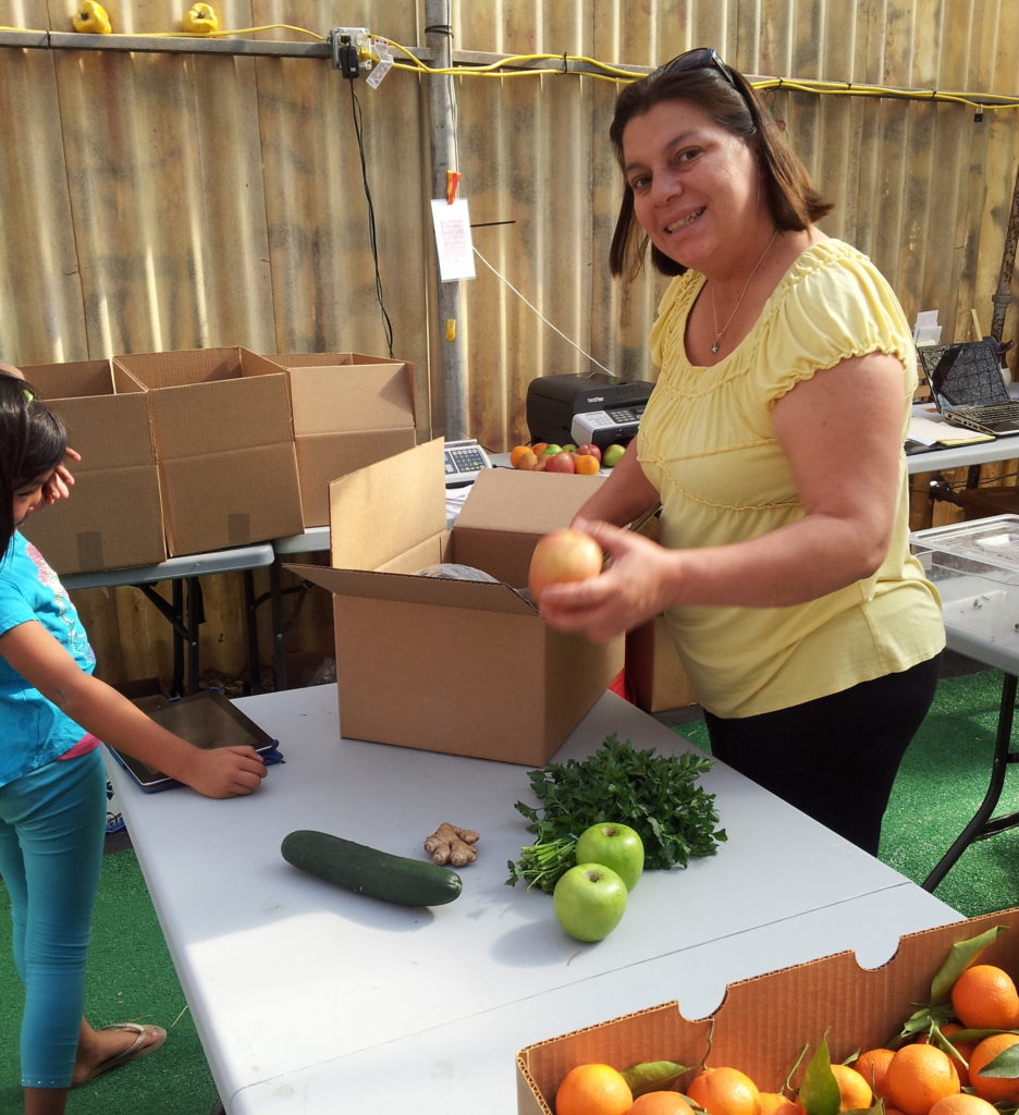 Ivonne helping to pack up delivery orders during Daily Harvest's early days. 