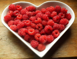 berries in a heart shaped dish